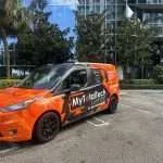 My Total Tech Support Company Van in front of an office building doing a service call